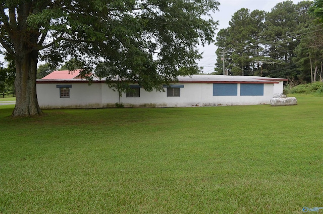 exterior space with a lawn