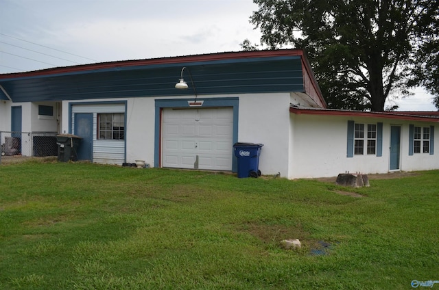 garage featuring a lawn