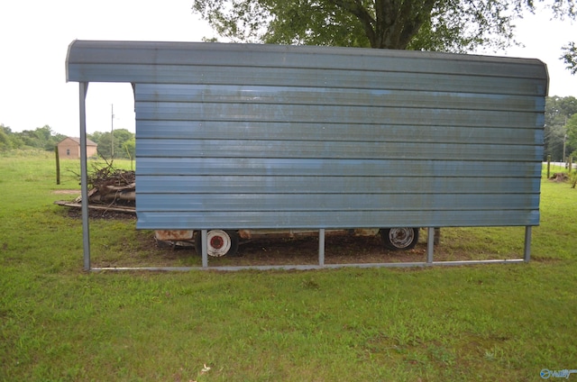 view of outbuilding with a yard