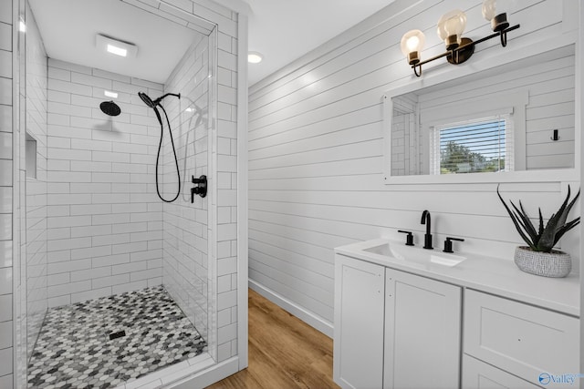 2605 Ready Section Rd, Toney, AL 35773 - bathroom featuring a shower stall, vanity, wood finished floors, and wooden walls