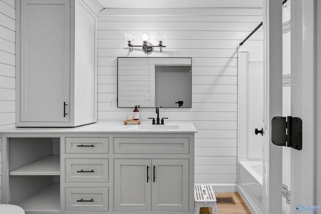 2605 Ready Section Rd, Toney, AL 35773 - full bath with wood walls, vanity, shower / bathtub combination with curtain, and wood finished floors