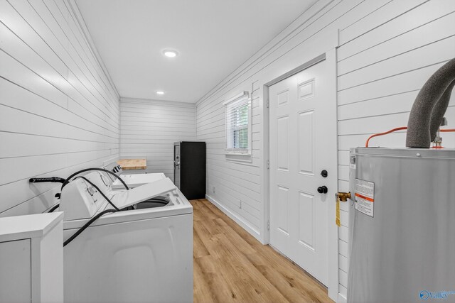 2605 Ready Section Rd, Toney, AL 35773 - laundry room featuring washing machine and clothes dryer, electric water heater, light wood-type flooring, wooden walls, and recessed lighting