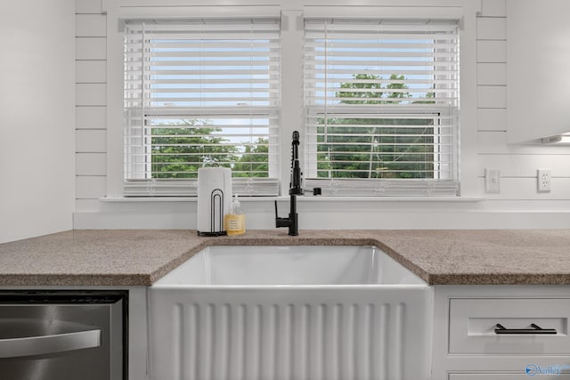 2605 Ready Section Rd, Toney, AL 35773 - kitchen view of stainless steel dishwasher, light countertops, and white cabinetry