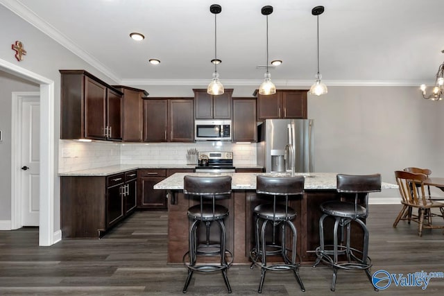 kitchen featuring stainless steel appliances, an island with sink, dark brown cabinetry, and dark wood-style flooring