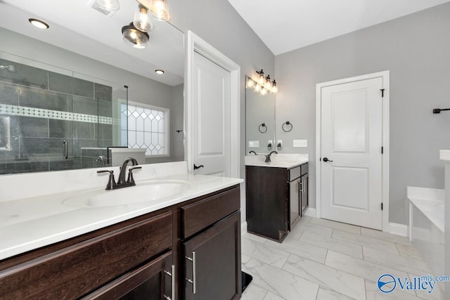 full bathroom featuring marble finish floor, two vanities, visible vents, a sink, and a shower stall