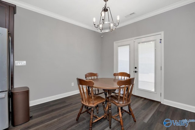 dining room featuring baseboards, dark wood-style flooring, visible vents, and crown molding