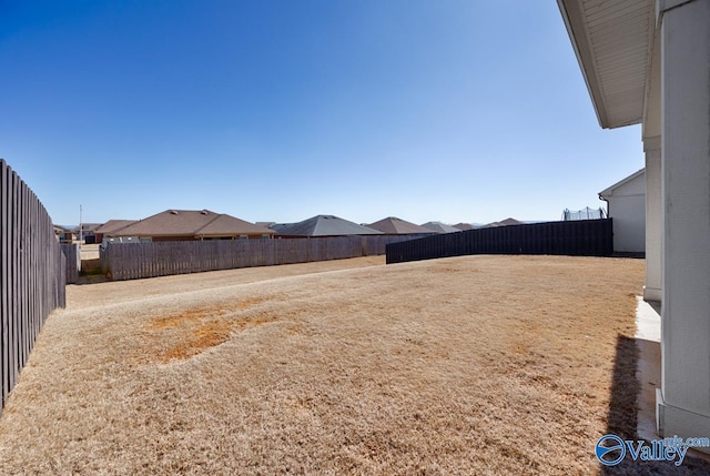 view of yard featuring a fenced backyard