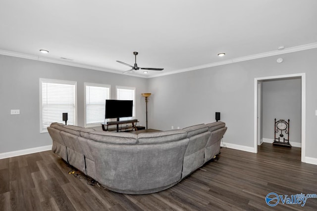 living room featuring a ceiling fan, baseboards, ornamental molding, and wood finished floors