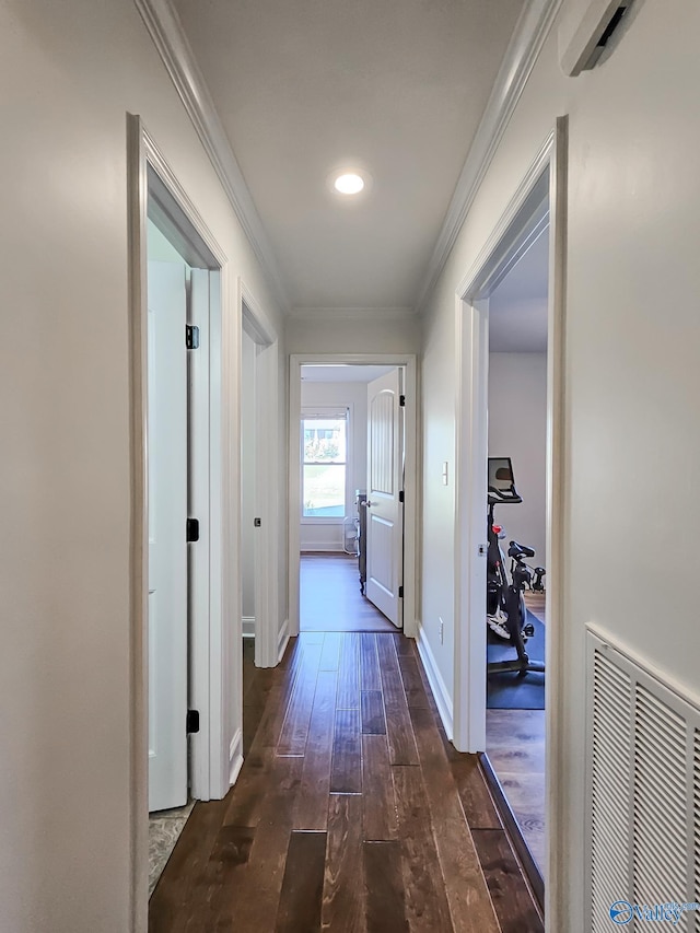 hall featuring crown molding and dark hardwood / wood-style floors