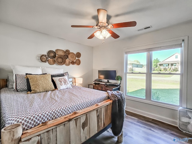 bedroom featuring ceiling fan and dark hardwood / wood-style flooring