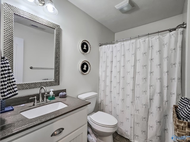 bathroom with vanity, toilet, and a shower with shower curtain