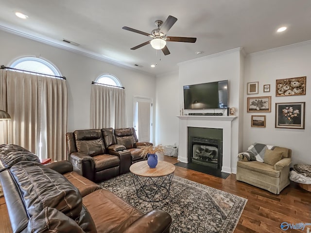 living room featuring ornamental molding, dark hardwood / wood-style floors, and ceiling fan