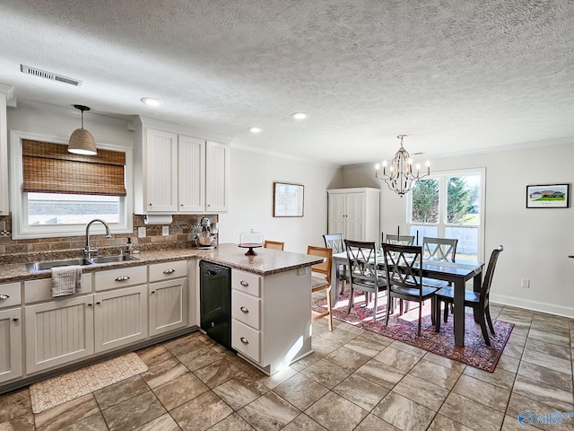 kitchen featuring plenty of natural light, black dishwasher, kitchen peninsula, and hanging light fixtures