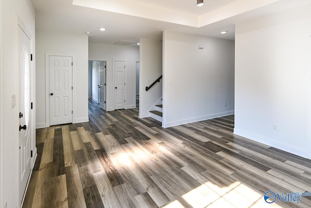 unfurnished room featuring dark wood-type flooring