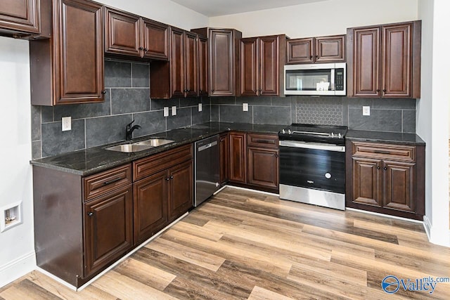 kitchen featuring light hardwood / wood-style flooring, sink, appliances with stainless steel finishes, and tasteful backsplash