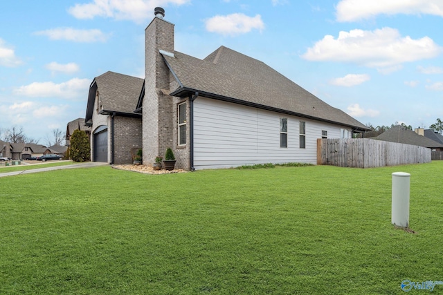 view of side of property with a yard