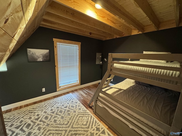 bedroom with hardwood / wood-style floors and vaulted ceiling