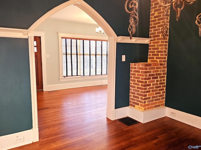 foyer entrance with hardwood / wood-style floors