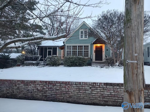 view of front of house featuring a sunroom