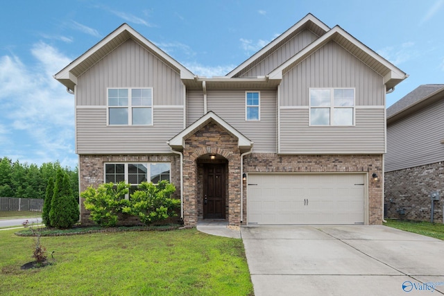 700 Magnolia Place Ln SW, Hartselle, AL 35640 - view of front of property with board and batten siding, a front yard, an attached garage, driveway, and brick siding