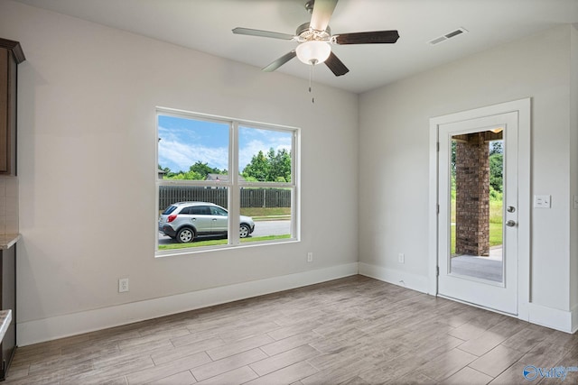 700 Magnolia Place Ln SW, Hartselle, AL 35640 - unfurnished room featuring wood finished floors, ceiling fan, and baseboards