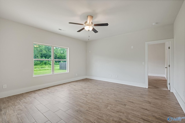 700 Magnolia Place Ln SW, Hartselle, AL 35640 - spare room featuring a ceiling fan, wood finished floors, baseboards, and a smoke detector