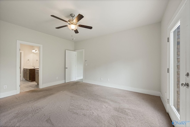 700 Magnolia Place Ln SW, Hartselle, AL 35640 - unfurnished bedroom with light carpet, baseboards, connected bathroom, and a ceiling fan