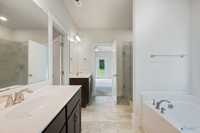 700 Magnolia Place Ln SW, Hartselle, AL 35640 - bathroom featuring a stall shower, a ceiling fan, two vanities, a bath, and marble finish flooring