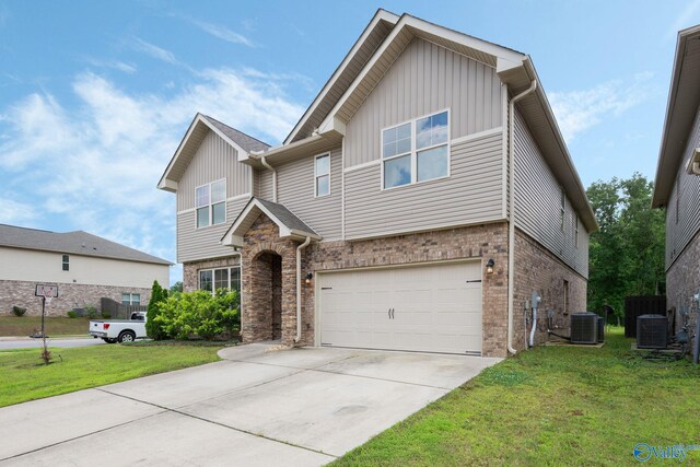 700 Magnolia Place Ln SW, Hartselle, AL 35640 - view of front facade with central air condition unit, a front lawn, board and batten siding, and an attached garage