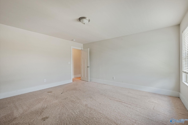 700 Magnolia Place Ln SW, Hartselle, AL 35640 - spare room featuring light colored carpet and baseboards