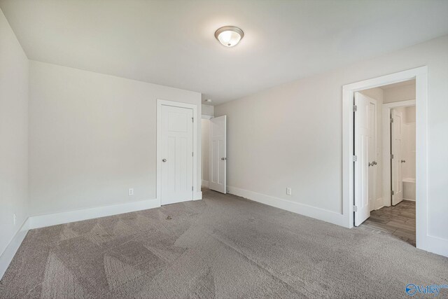 700 Magnolia Place Ln SW, Hartselle, AL 35640 - unfurnished bedroom featuring carpet floors and baseboards