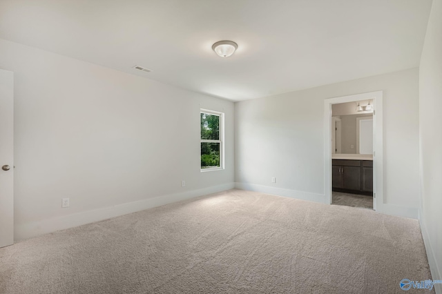 700 Magnolia Place Ln SW, Hartselle, AL 35640 - unfurnished bedroom with carpet floors, baseboards, and ensuite bath