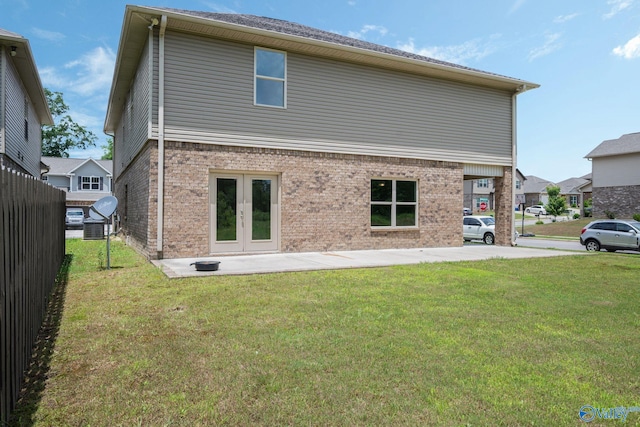 700 Magnolia Place Ln SW, Hartselle, AL 35640 - back of property with brick siding and french doors