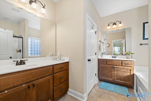 bathroom featuring an enclosed shower and vanity