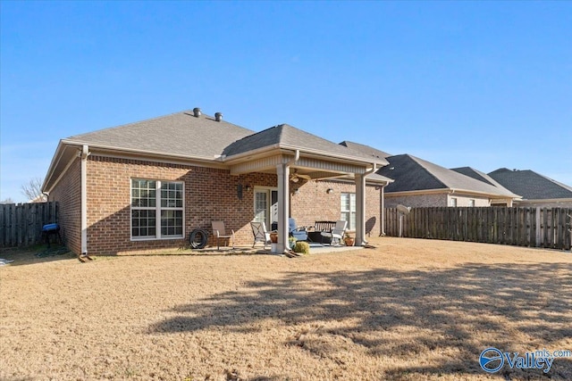 rear view of house with a patio