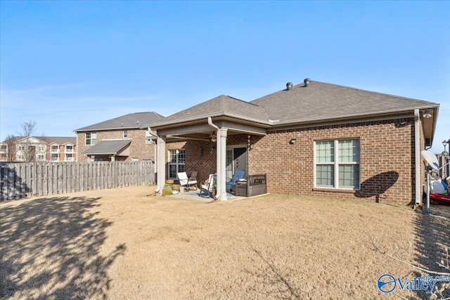 back of property featuring a patio area