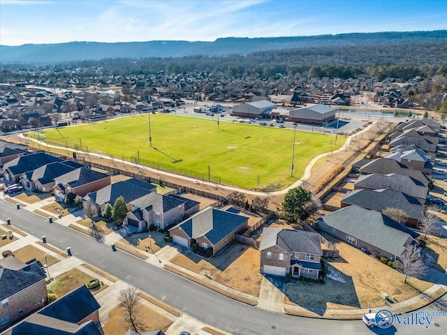 birds eye view of property with a mountain view