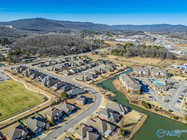 bird's eye view with a water and mountain view