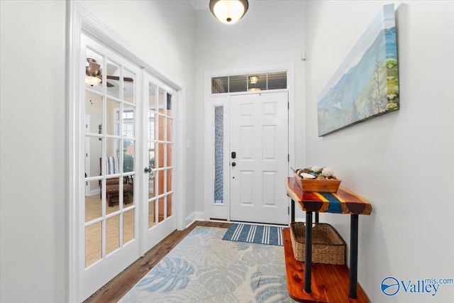 entrance foyer with french doors and hardwood / wood-style floors