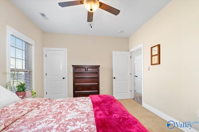 carpeted bedroom with ceiling fan