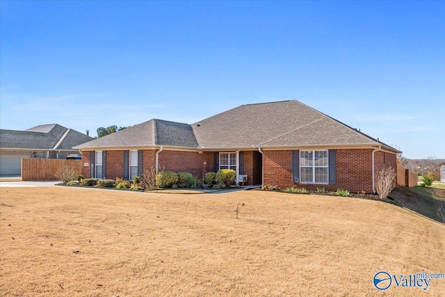 ranch-style house featuring a front lawn