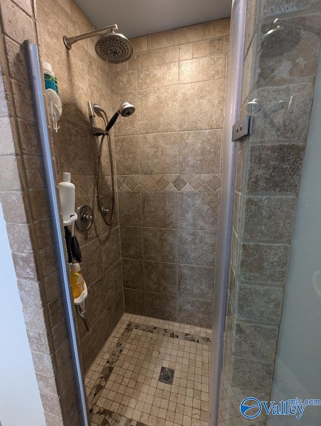 bathroom with tiled shower