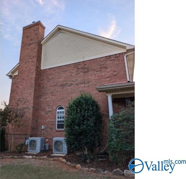 view of property exterior with ac unit