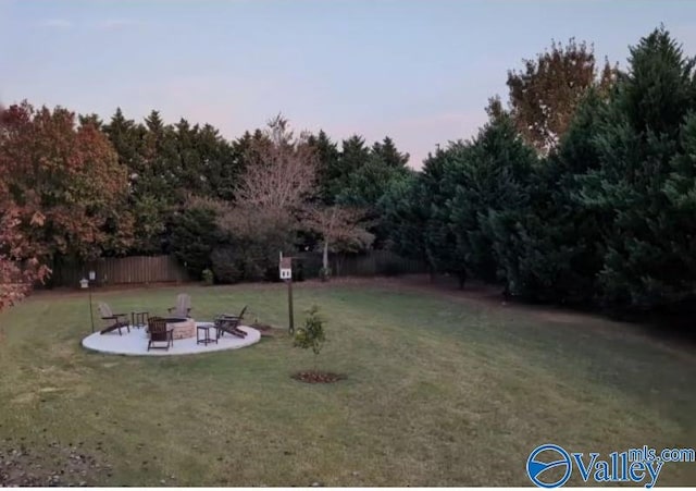 yard at dusk with an outdoor fire pit