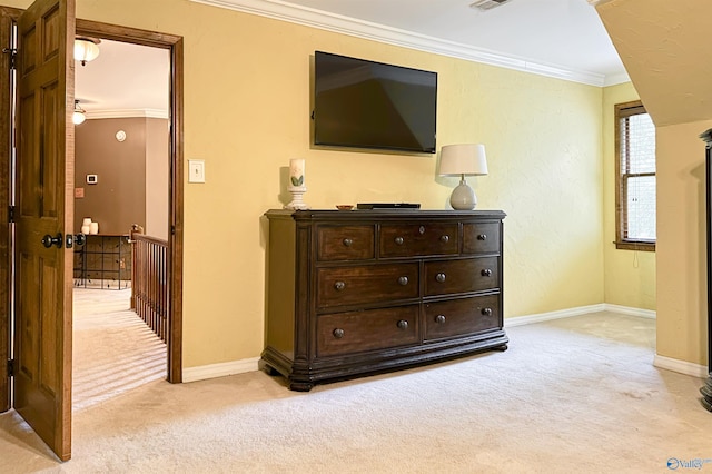 bedroom featuring light carpet, visible vents, baseboards, and crown molding