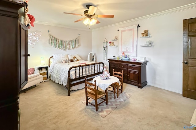 bedroom featuring crown molding, baseboards, a ceiling fan, and light colored carpet