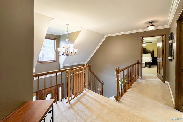 stairs featuring crown molding, carpet, and ceiling fan with notable chandelier