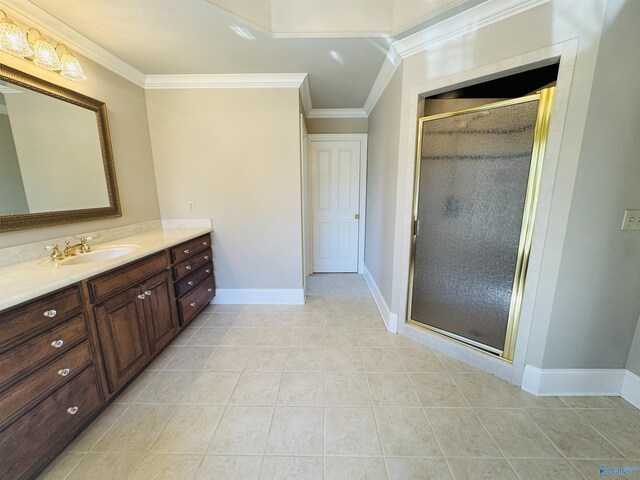full bath featuring vanity, ornamental molding, baseboards, and a shower stall