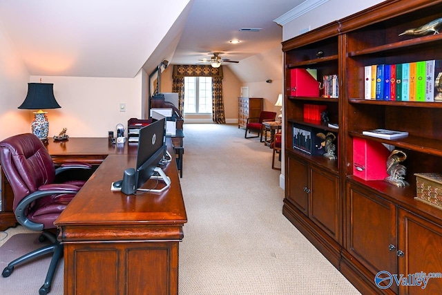 carpeted home office featuring lofted ceiling, visible vents, and a ceiling fan