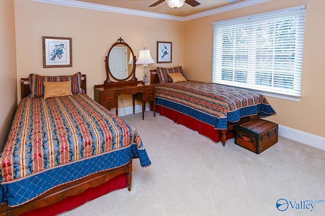bedroom with a ceiling fan, crown molding, carpet, and baseboards